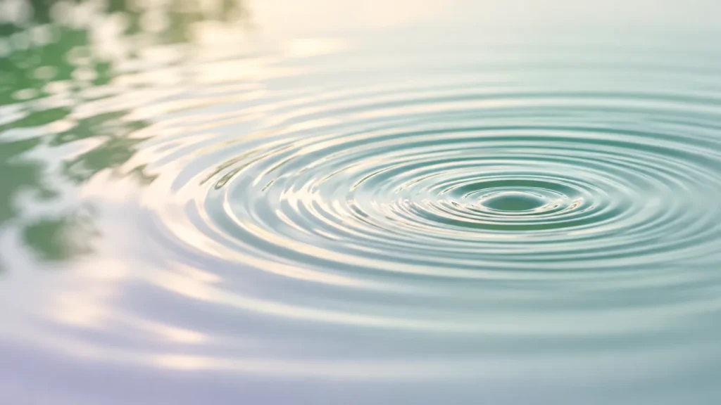 Soft concentric ripples spread across calm water, symbolizing how inflammation begins as a response to a disturbance and gradually resolves as the body returns to balance.